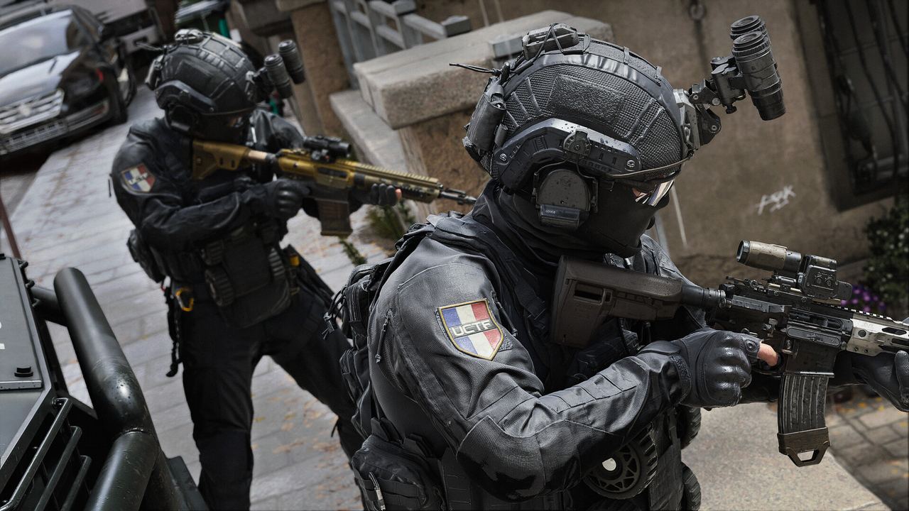 Two Modern Warfare 4 operators clearing a building entrance